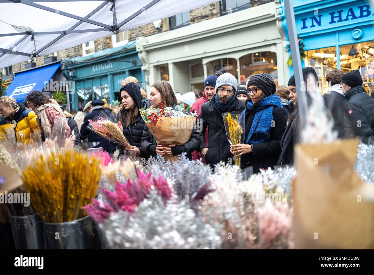 London, Uk - 17 December 2022, Columbia Road Flower Market is a street market. People choose and buy flowers Stock Photo