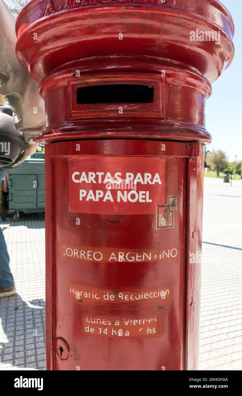 Red mail post box in Buenos Aires, Argentina with sticker announcing 'Letters for Father Christmas' Stock Photo