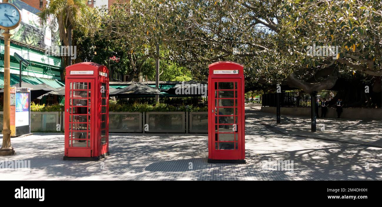 Two formerly British red telephone boxes stand in Recoleta, Buenos Aires, Argentina Stock Photo