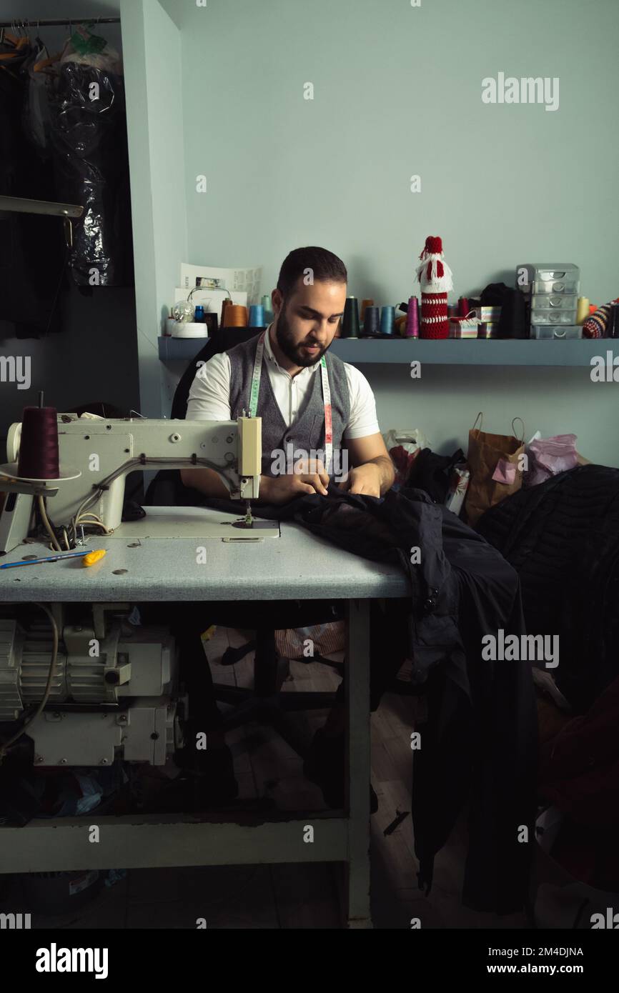 Man sewing Stock Photo