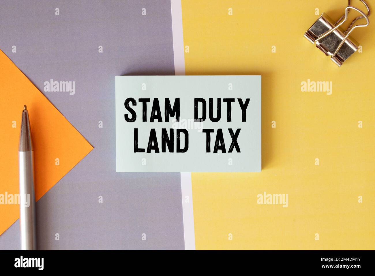 SDLT - Stamp Duty Land Tax write on a card on office desk Stock Photo ...