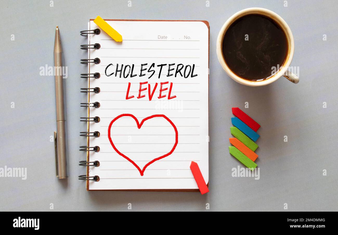 Text Cholesterol LEVELS on paper in doctor's hand with stethoscope, medical concept. Stock Photo