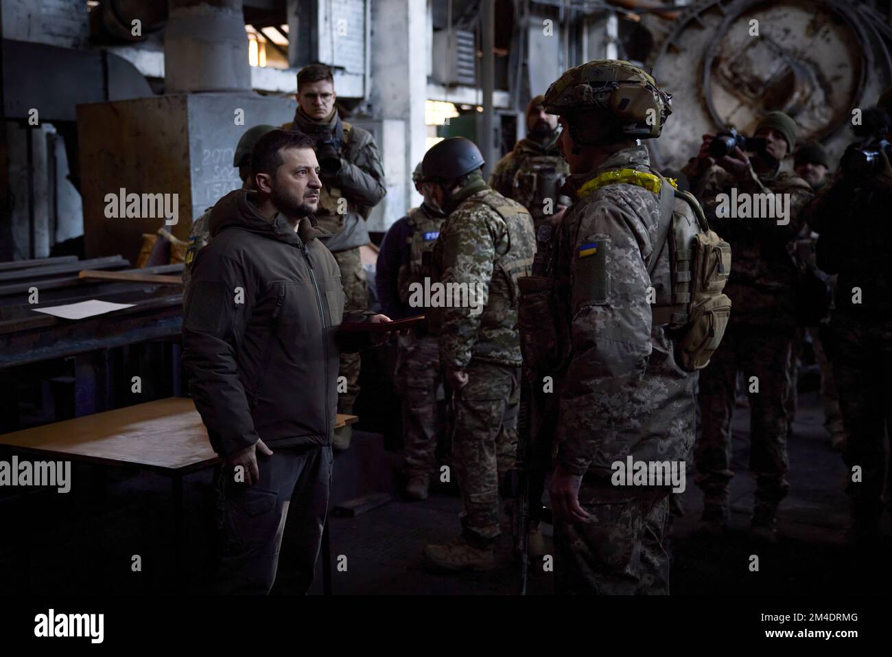 The President of Ukraine, Volodymyr Zelensky, was on a working trip to the Donetsk region, where he met with the Ukrainian servicemen who are defending the city of Bakhmut.  The Head of State visited the frontline positions of one of the mechanized brigades, the personnel of which is confronting the enemy on the approaches to the city. The President listened to the commander's report on the operational situation, logistical support and proposals for further actions. (Photo: The Ukrainian Presidential Office) Stock Photo