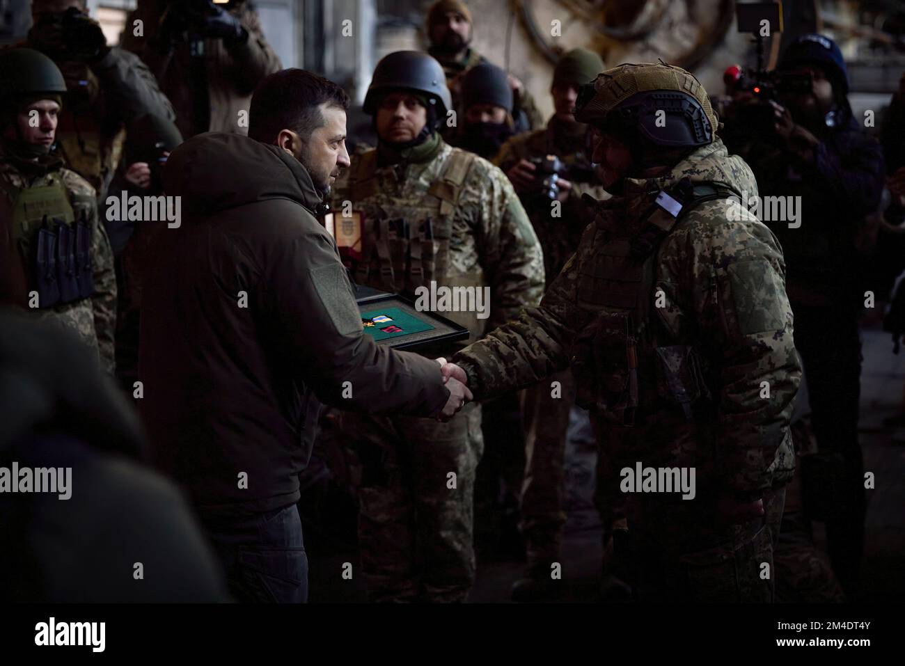 The President of Ukraine, Volodymyr Zelensky, was on a working trip to the Donetsk region, where he met with the Ukrainian servicemen who are defending the city of Bakhmut.  The Head of State visited the frontline positions of one of the mechanized brigades, the personnel of which is confronting the enemy on the approaches to the city. The President listened to the commander's report on the operational situation, logistical support and proposals for further actions. (Photo: The Ukrainian Presidential Office) Stock Photo