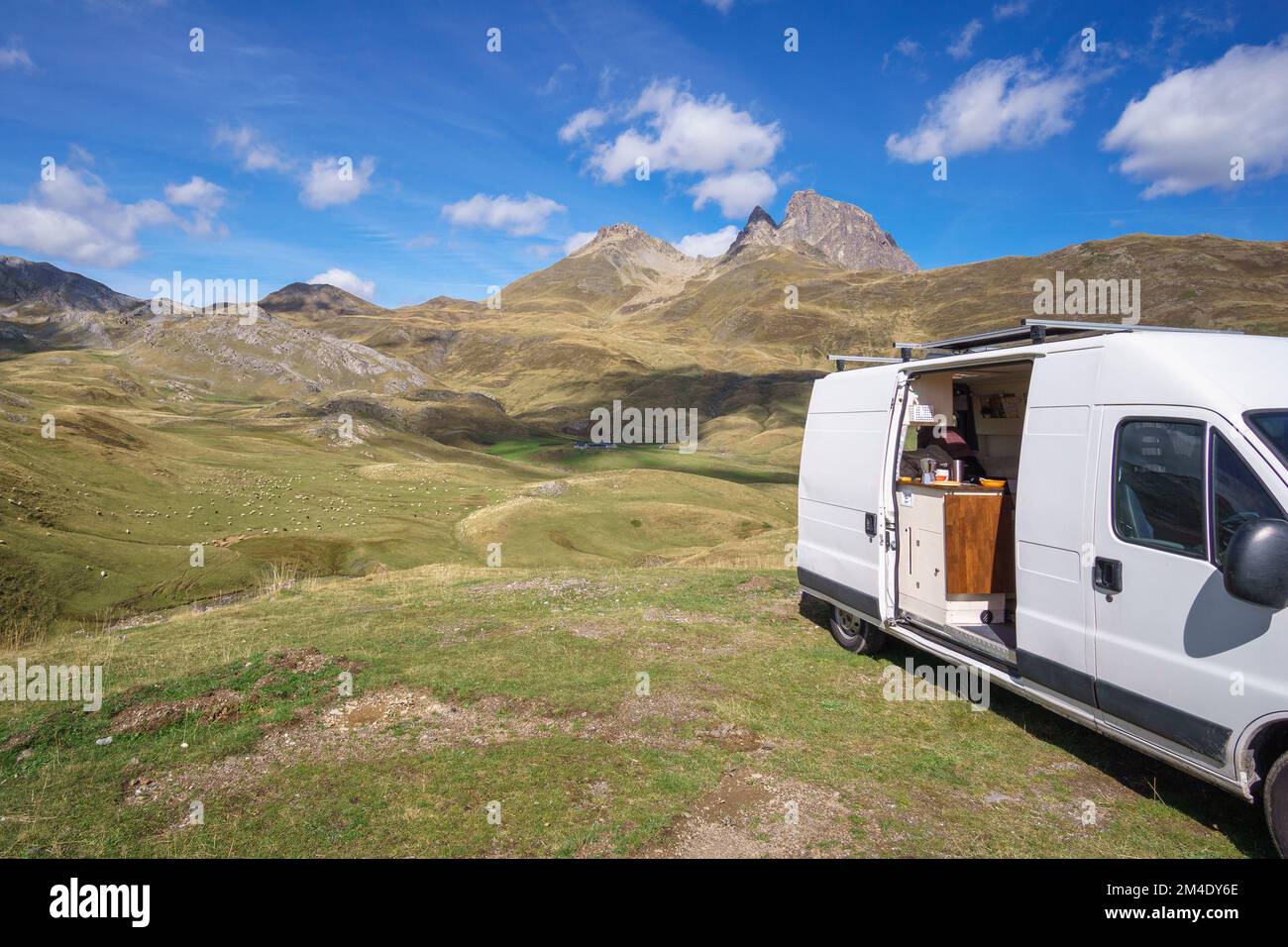 Camper van in front of Pyrenees Mountains with Pic du Midi d'Ossau at the french and spanish border, Col du Pourtalet, Nouvelle-Aquitaine, France Stock Photo