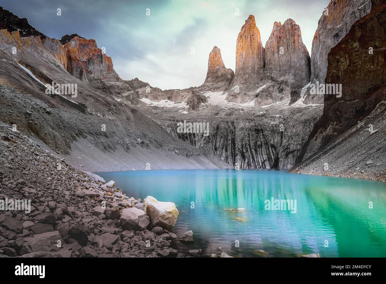 Torres Del Paine granites at sunrise and lake reflection, Chilean Patagonia Stock Photo