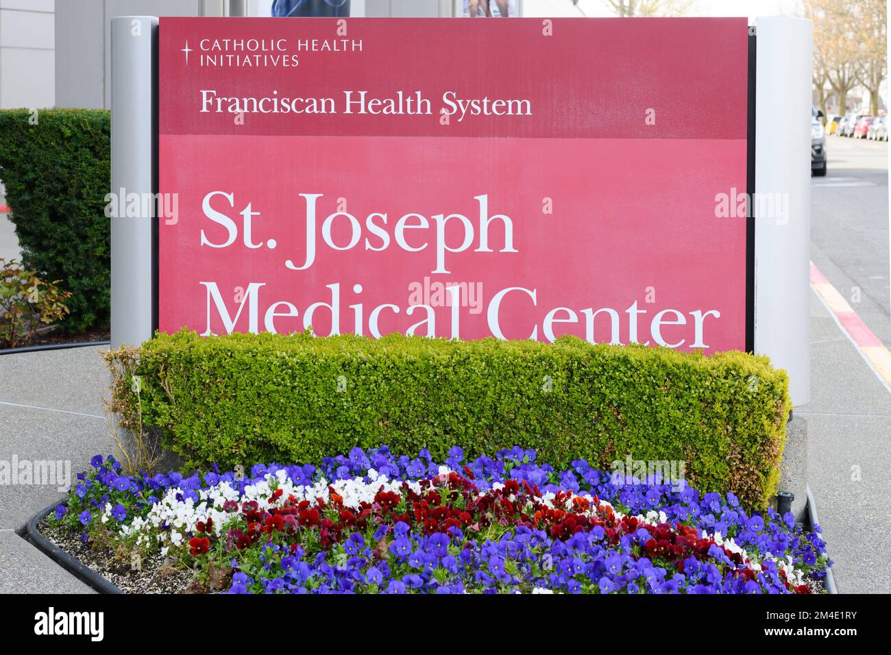 Tacoma, WA, USA - April 23, 2022; Sign for St Joseph Medical Center in Tacoma Washington with flowers..  The hospital is a part of the Franciscan Stock Photo