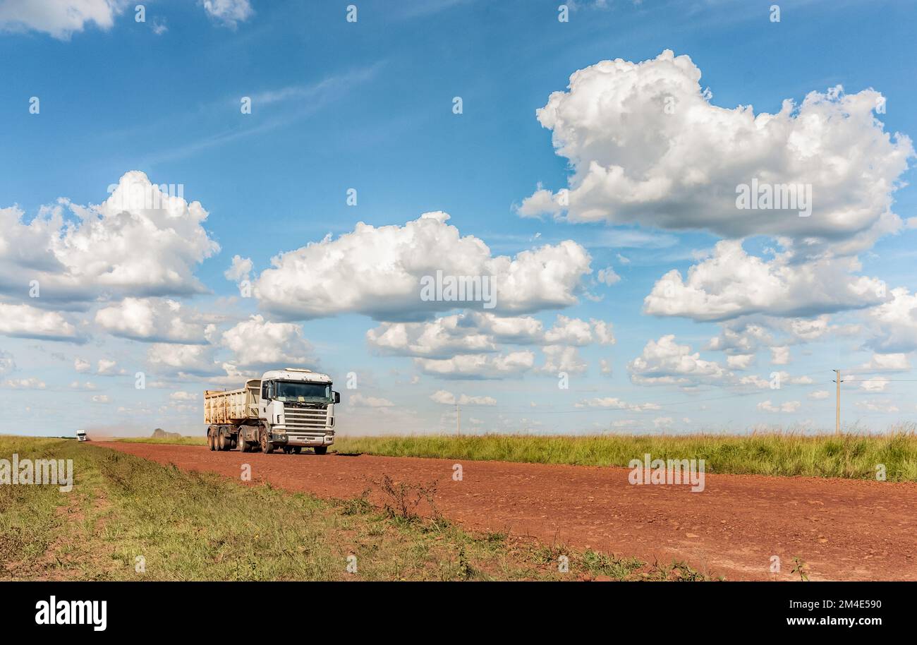 COLONIA CARLOS PELLEGRINI, CORRIENTES, ARGENTINA - NOVEMBER 19, 2021: A truck drives in the gravel road that join the city of Mercedes and the small t Stock Photo