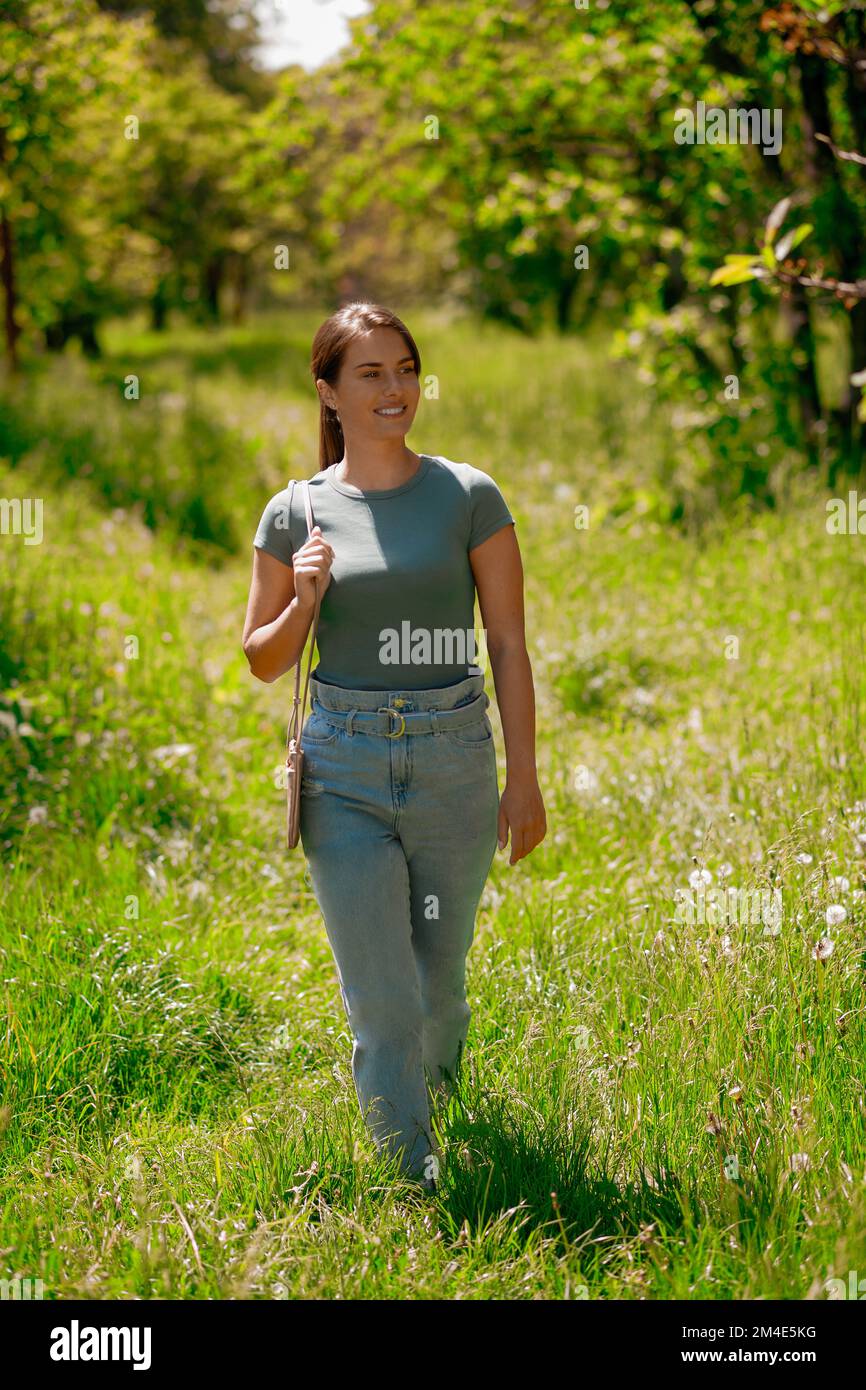 Young pretty woman walking in hi-res stock photography and images - Alamy