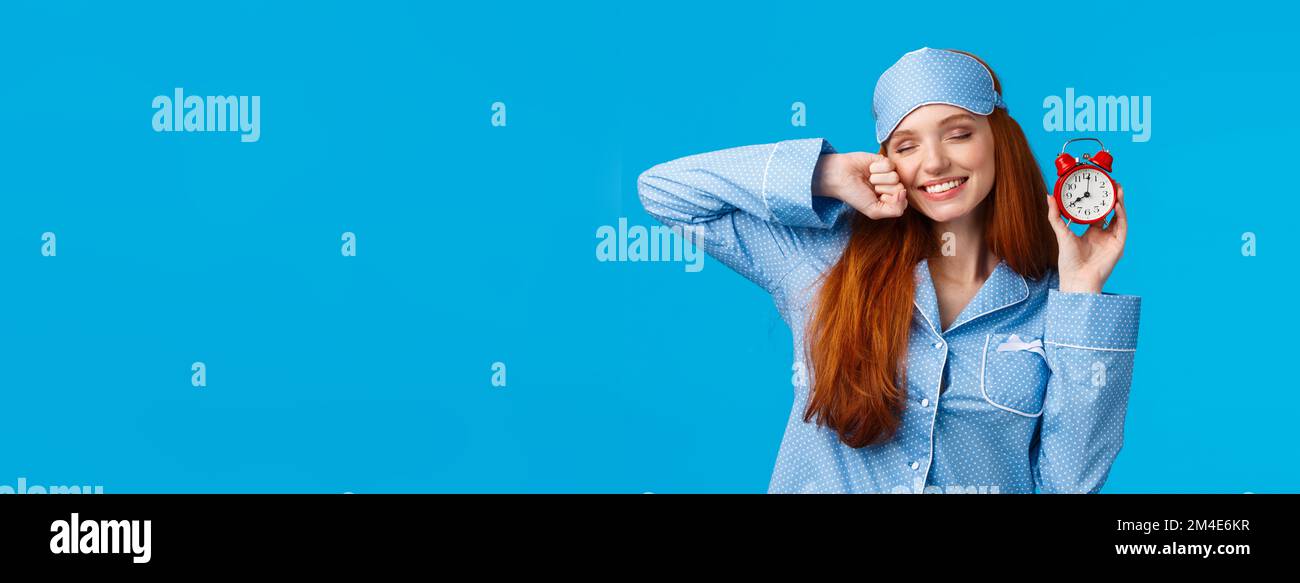 Girl slept well, wake up energized, sleepy stretching with closed eyes