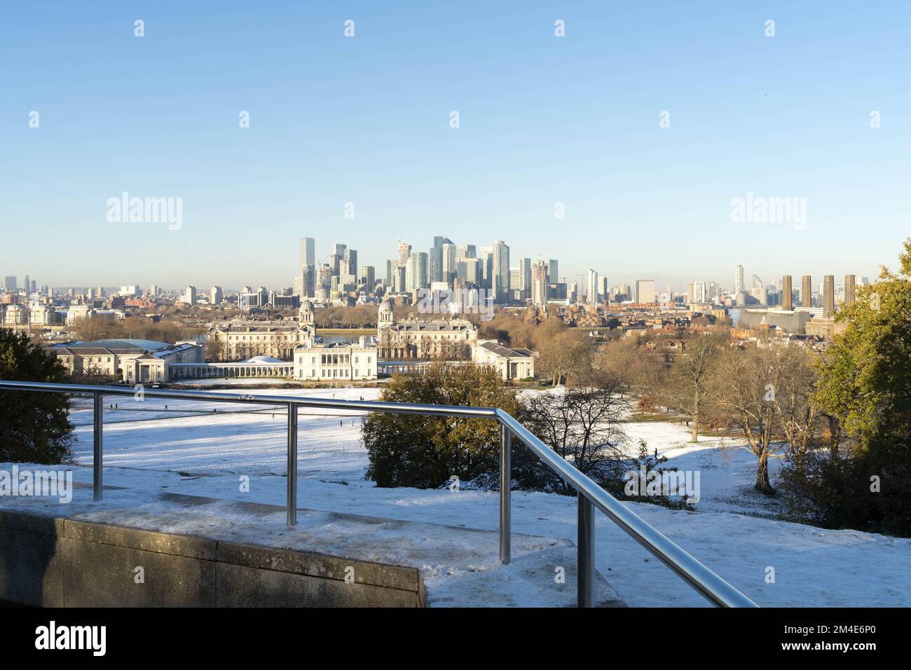 Winter sunshine seen in Greenwich park covered in heavy snow brought in by arctic blast Southeast London England Stock Photo