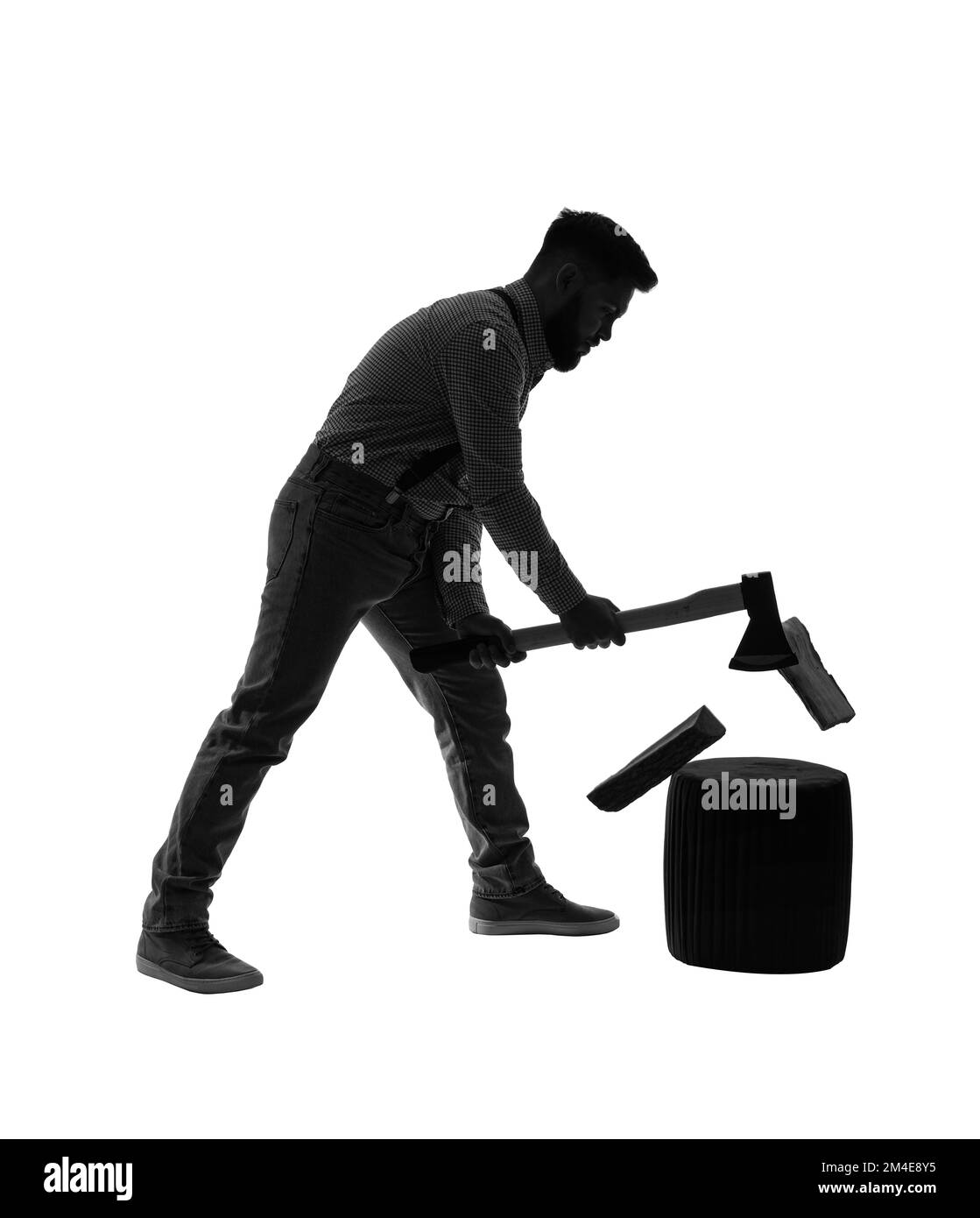 Silhouette of young man chopping wood on white background Stock Photo