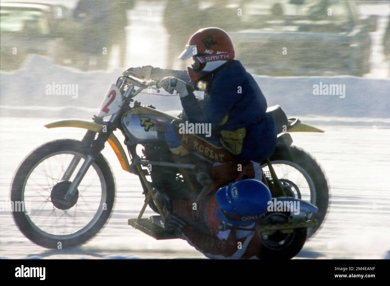 Motorcycle ice racer with a partner in the sidecar used to balance when cornering. Circa 1990 Stock Photo