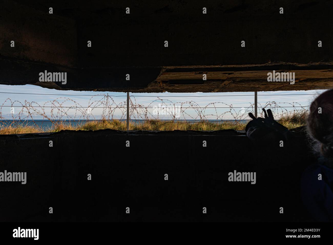 Inside German gun placement at Omaha Beach looking out into the English Channel Stock Photo