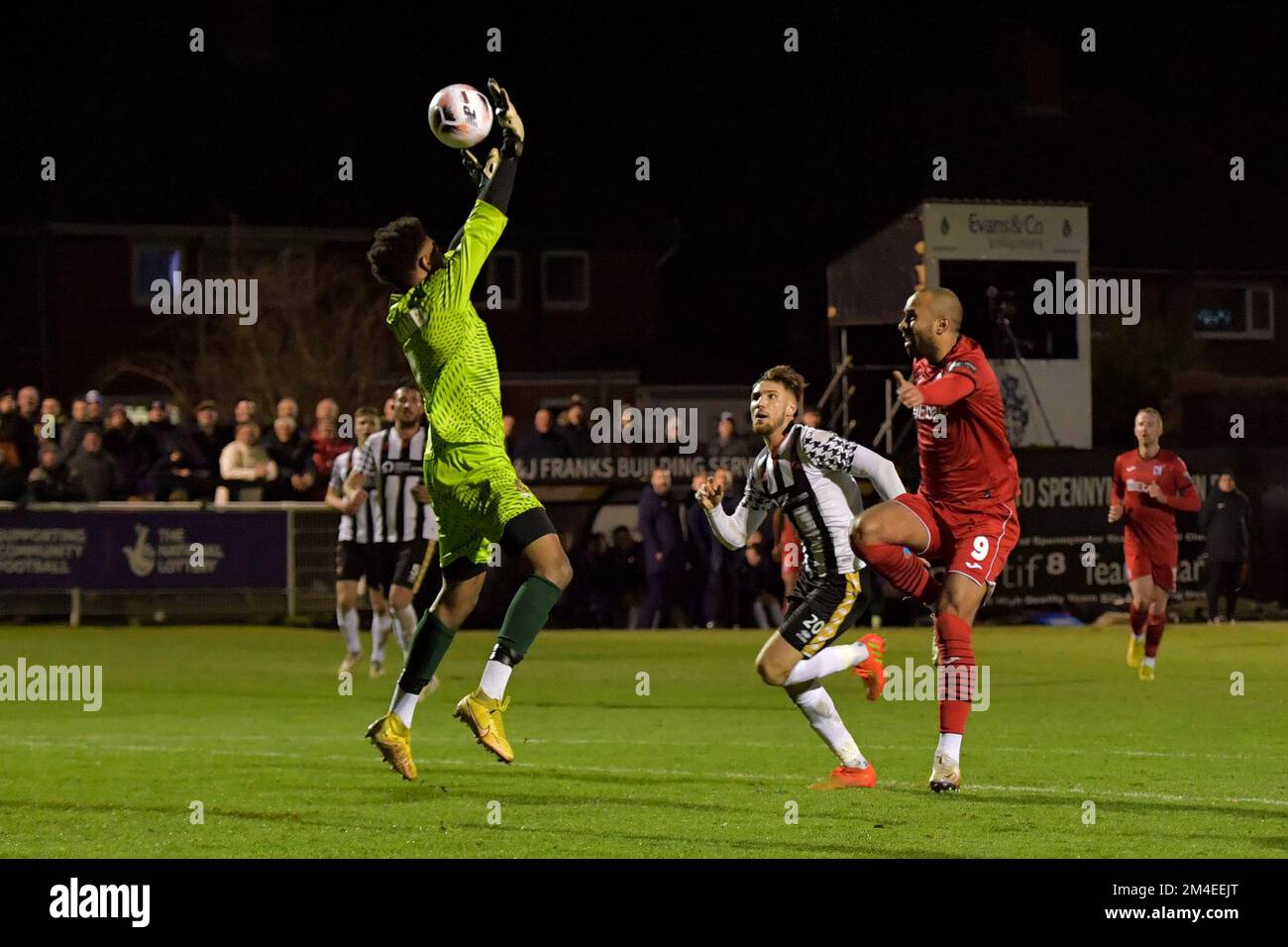 Darlington's Jacob Hazel lobs the ball over Spennymoor Town's Gio Bellagambi only for Spennymoor Town's Finn Cousin Dawson to clear the ball off the line during The Isuzu FA Trophy match between Spennymoor Town and Darlington at the Brewery Field, Spennymoor on Tuesday 20th December 2022. (Credit: Scott Llewellyn | MI News) Credit: MI News & Sport /Alamy Live News Stock Photo