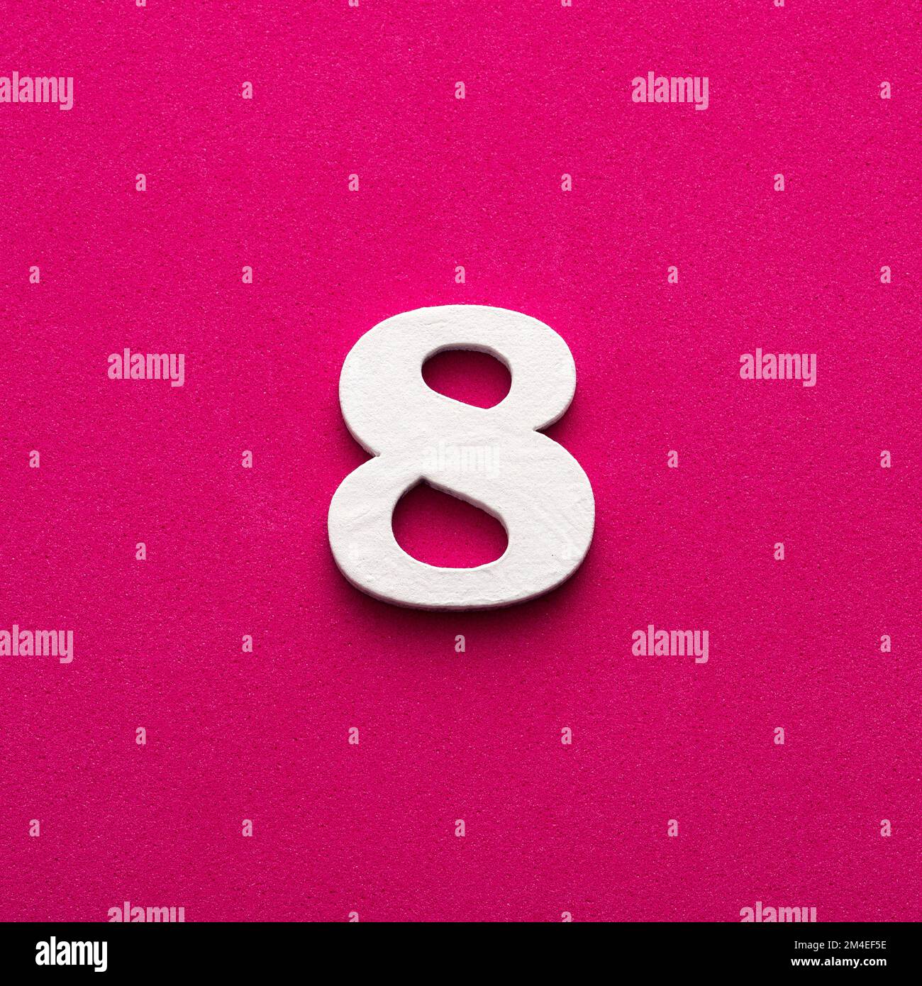 Number 8 White wooden number on rhodamine red background Stock Photo Number 8 White wooden number on rhodamine red background Stock Photo