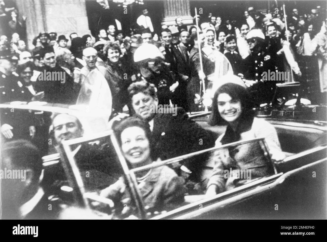 The President and First Lady in the rear seat of the presidential limousine minutes before the assassination Stock Photo