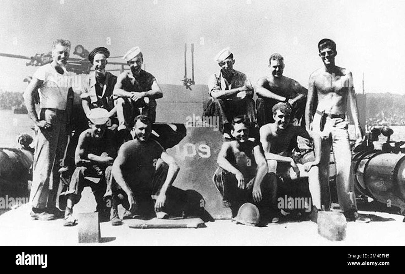 US President Kennedy as a Lieutenant (junior grade) (standing at right) with his torpedo boat PT-109 crew, 1943 Stock Photo