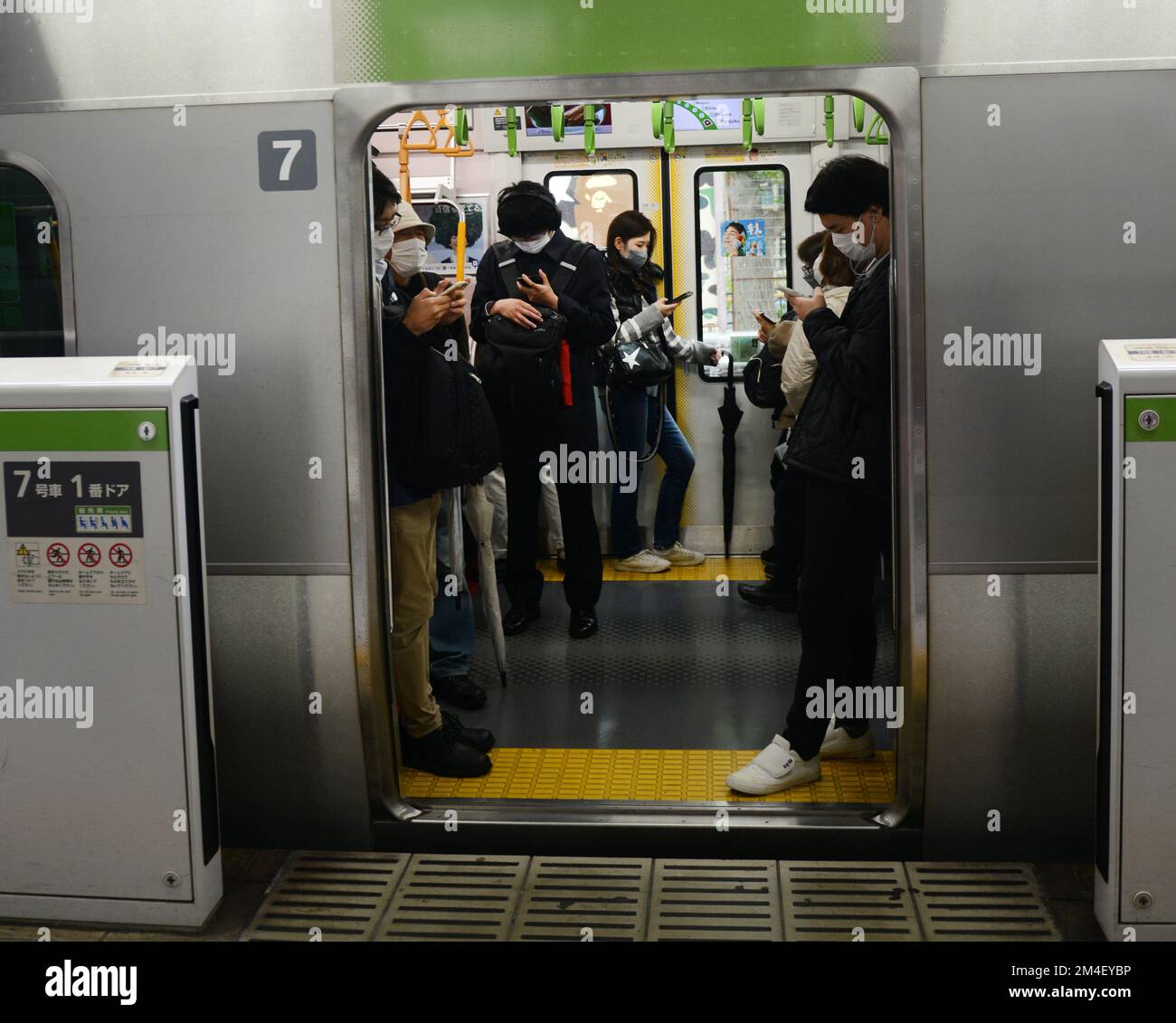 Japanese passengers on the JR Yamanote line in Tokyo, Japan Stock Photo