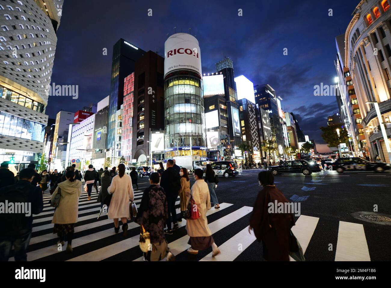 Pedestrians crossing Ginza 4 chome in Ginza, Tokyo, Japan. Stock Photo