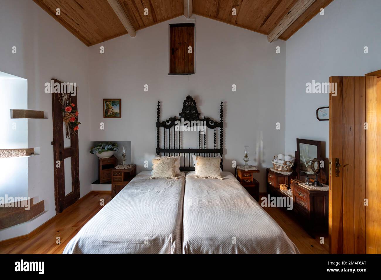 Rustic bedroom with two separate beds put together Stock Photo Alamy