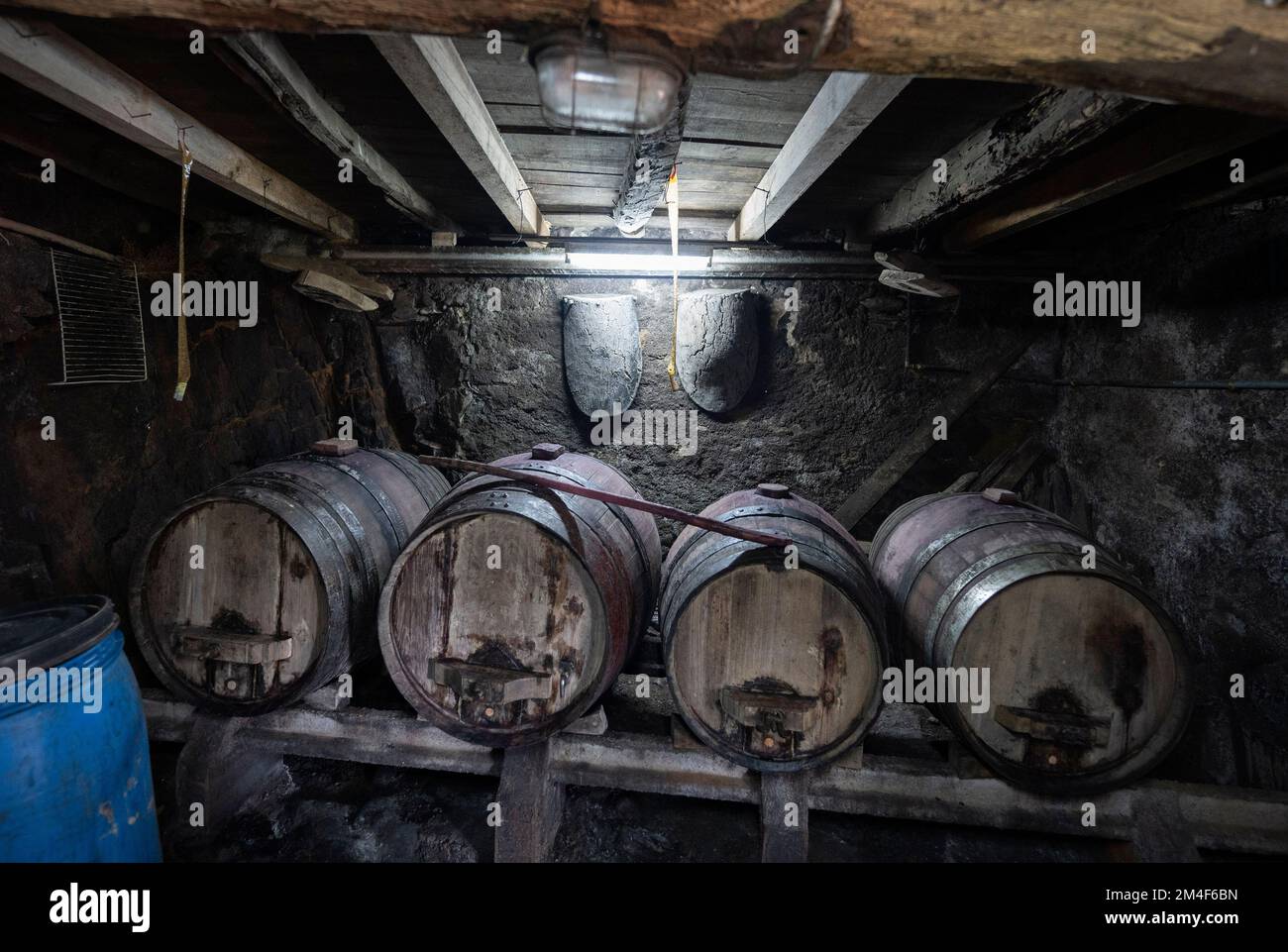 Four wine barrels on a rustic old cellar in the basement of a country house Stock Photo