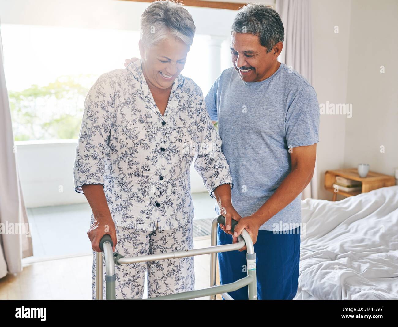 Small steps my dear. a determined mature woman using a walking frame to