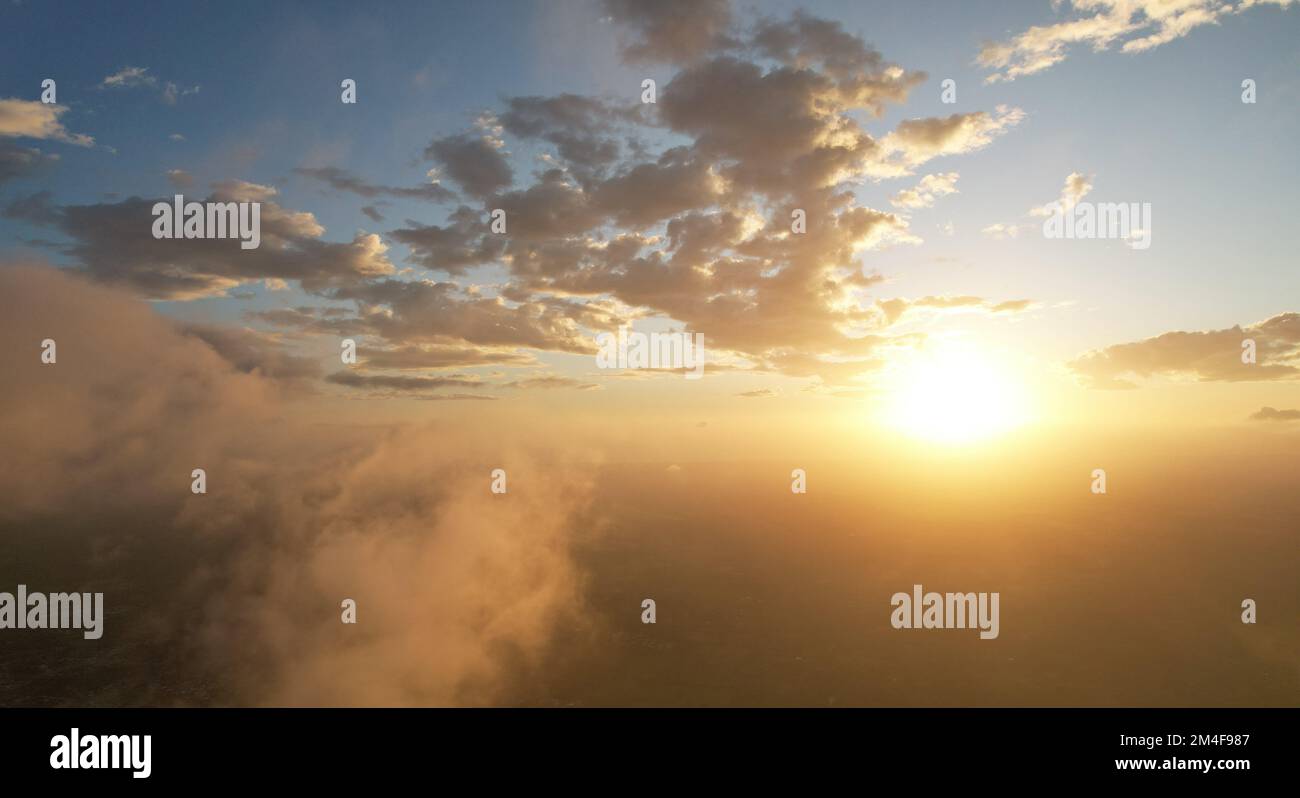 Sky with orange color clouds aerial drone view background Stock Photo