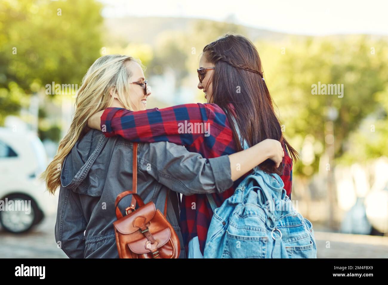 Were always ready for a new adventure. Rearview shot of two unrecognizable female friends sight seeing in the city. Stock Photo