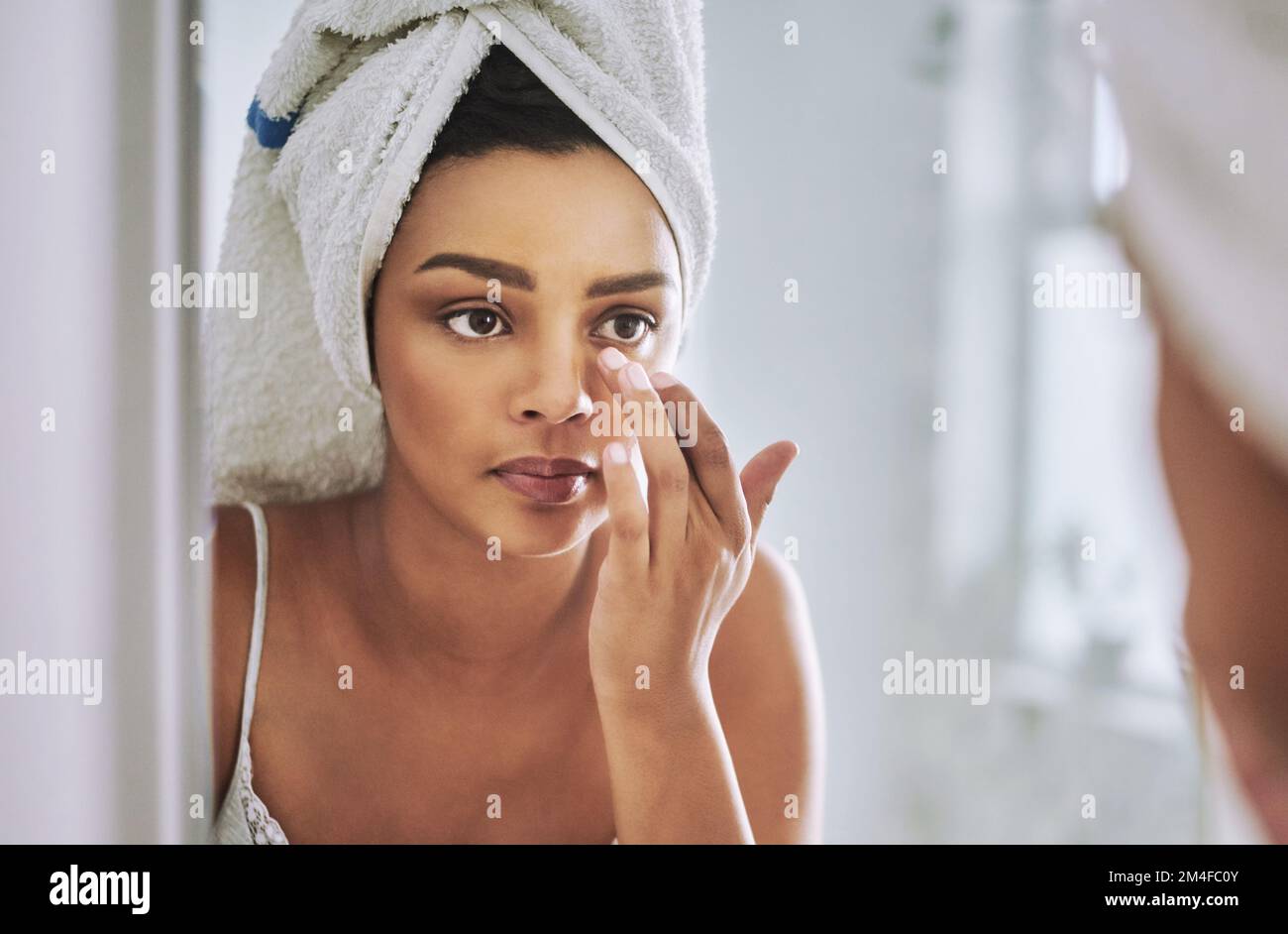 Better watch out for those wrinkles. an attractive young woman looking