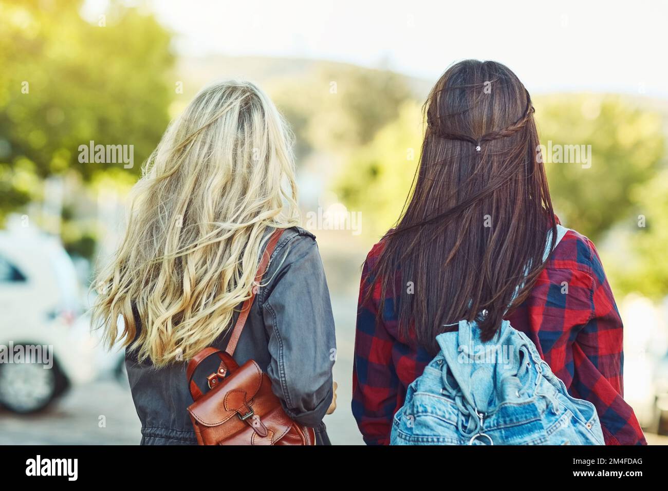 The two travelling peas in a pod. Rearview shot of two unrecognizable female friends sight seeing in the city. Stock Photo