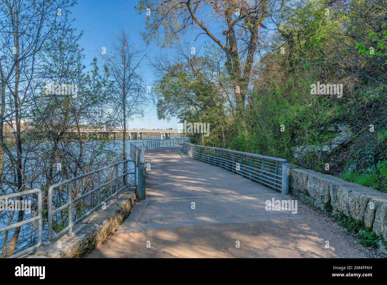 Austin, Texas- Boardwalk beside the mountain and river. Concrete bike 