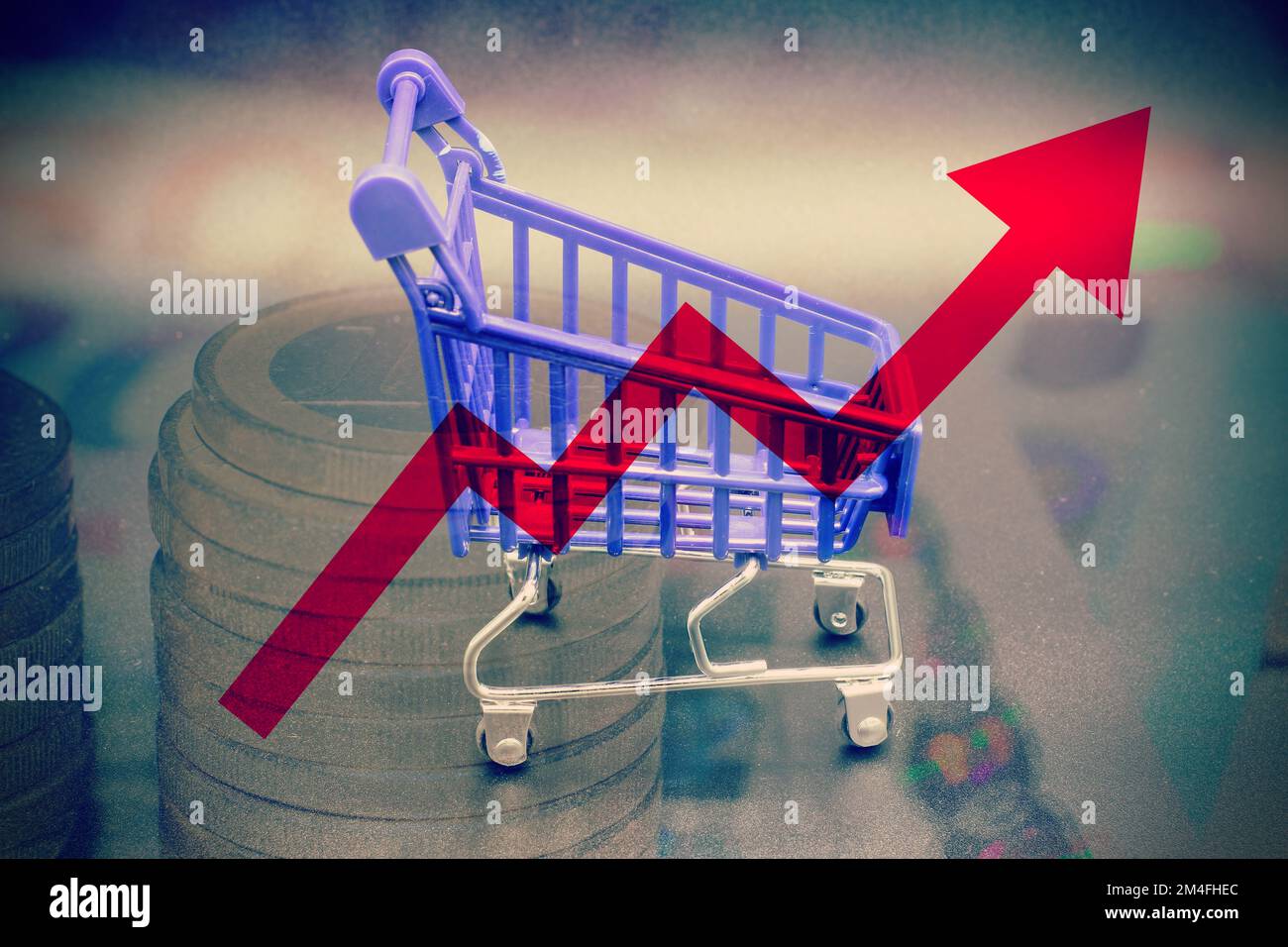 Isolated shopping cart with a red graph arrow concept of rising food cost and grocery prices