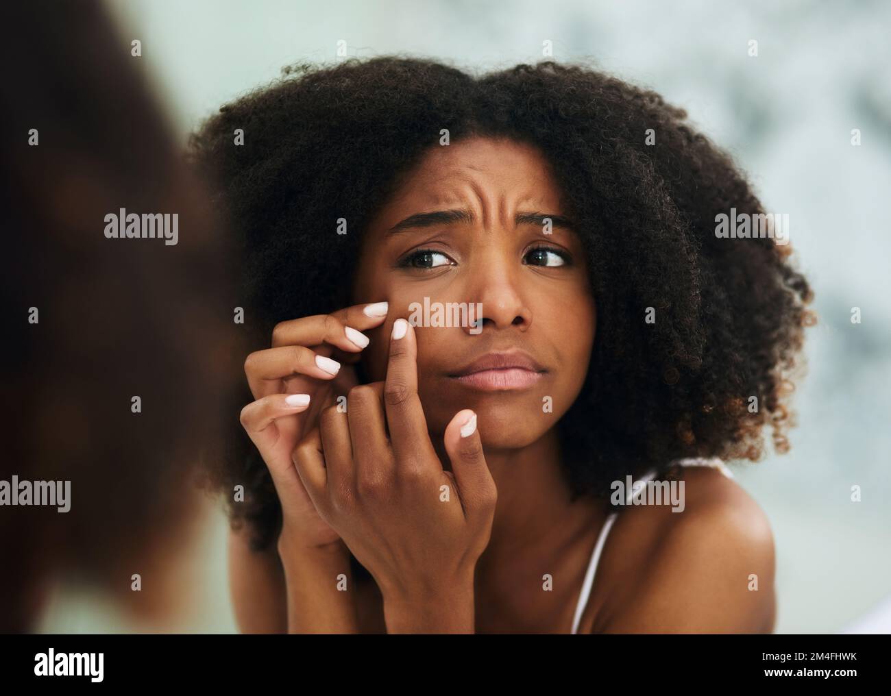 I cant be breaking out now. an attractive young woman squeezing a