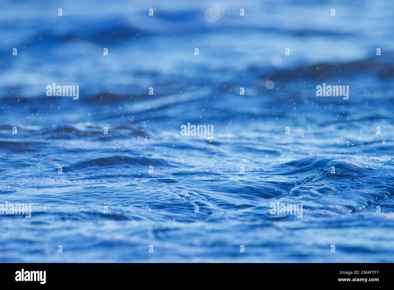 Blue ocean water background Stock Photo - Alamy