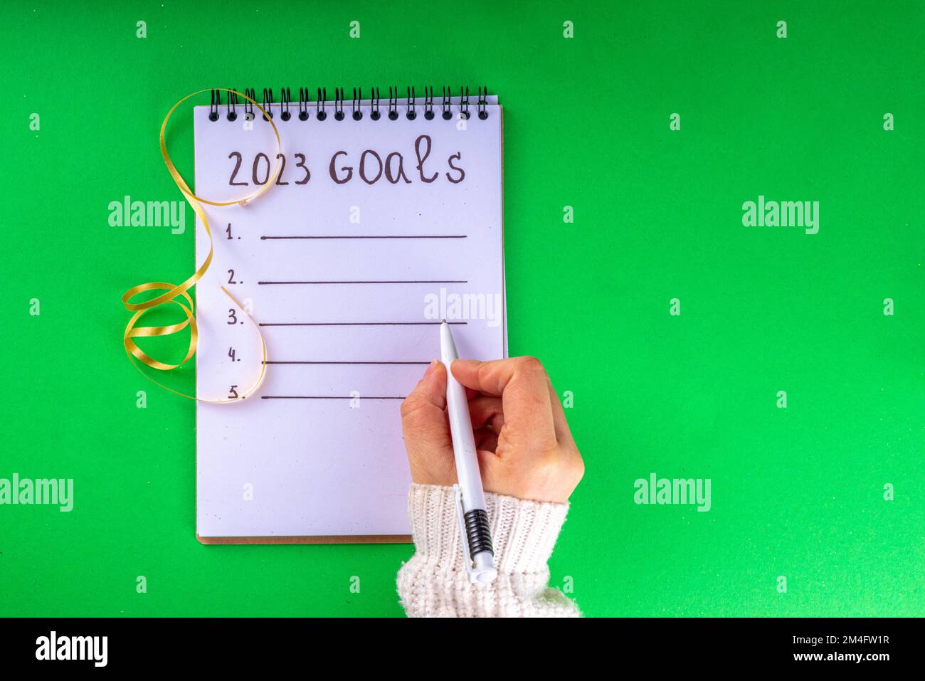 Notebook with New's Year Resolutions massage, with Christmas ornaments