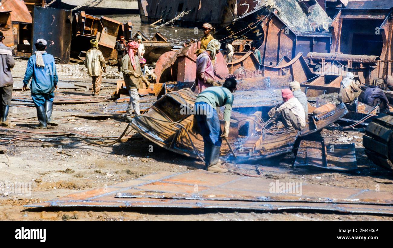 Alang is the largest shipbreaking-place on earth. Labor from the poor areas of India work under horrible conditions. Stock Photo