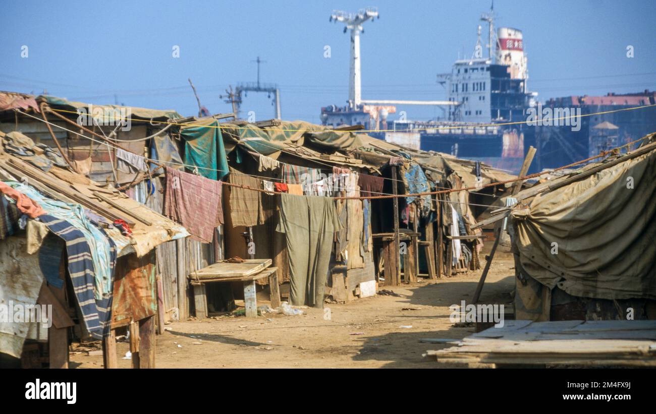 Alang is the largest shipbreaking-place on earth. Labor from the poor areas of India work under horrible conditions. Stock Photo