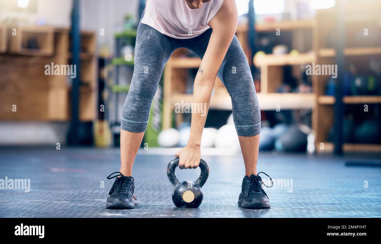 Fitness, gym and kettlebell training by woman hands weightlifting for health, wellness and power goals, Exercise, weights and hand of girl in sports Stock Photo