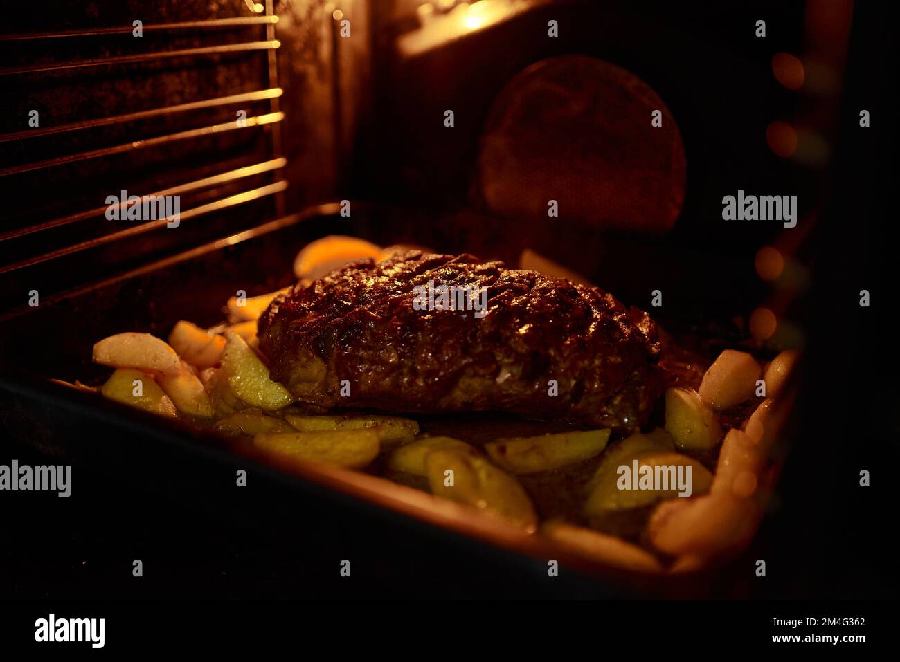 Cooking homemade food in an electric oven. Vegetable stew with potatoes