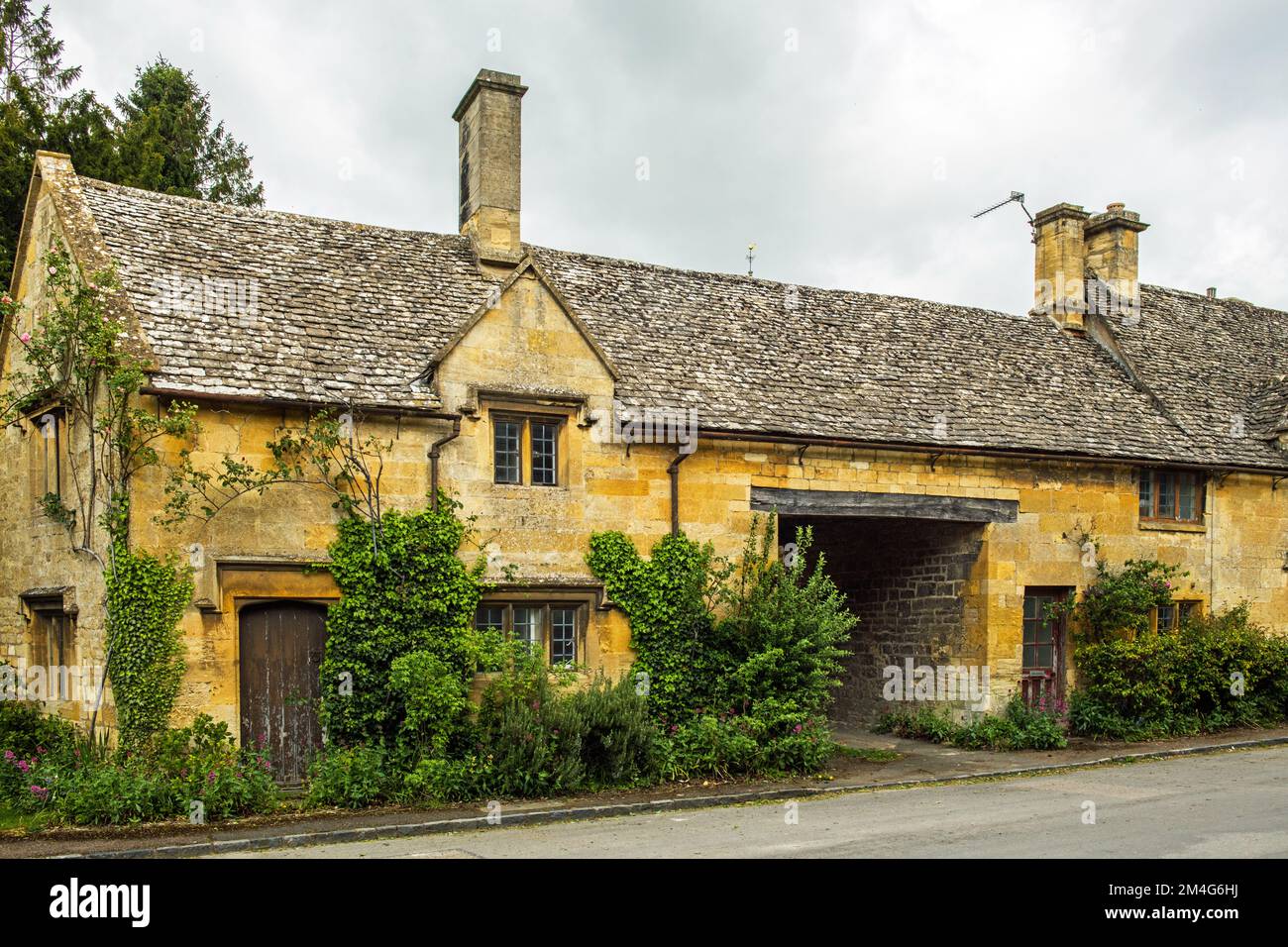 Limestone cottages in the picturesque Cotswolds village of Stanton in Gloucestershire. Stock Photo