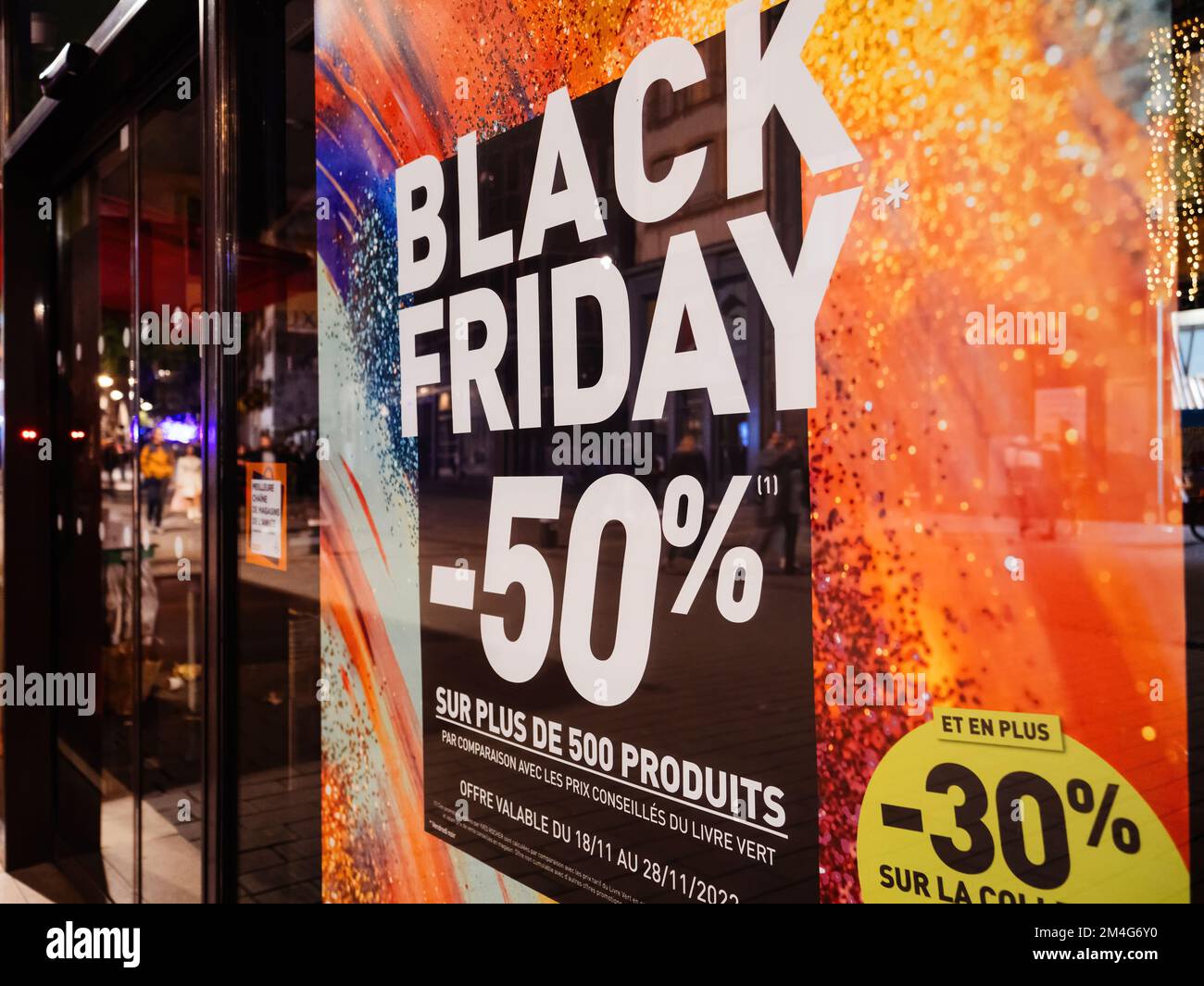 Strasbourg, France - Nov 25, 2022: fashion store Black Friday signage on the showcase with text in French language translated - more than 500 products discounted inside Stock Photo