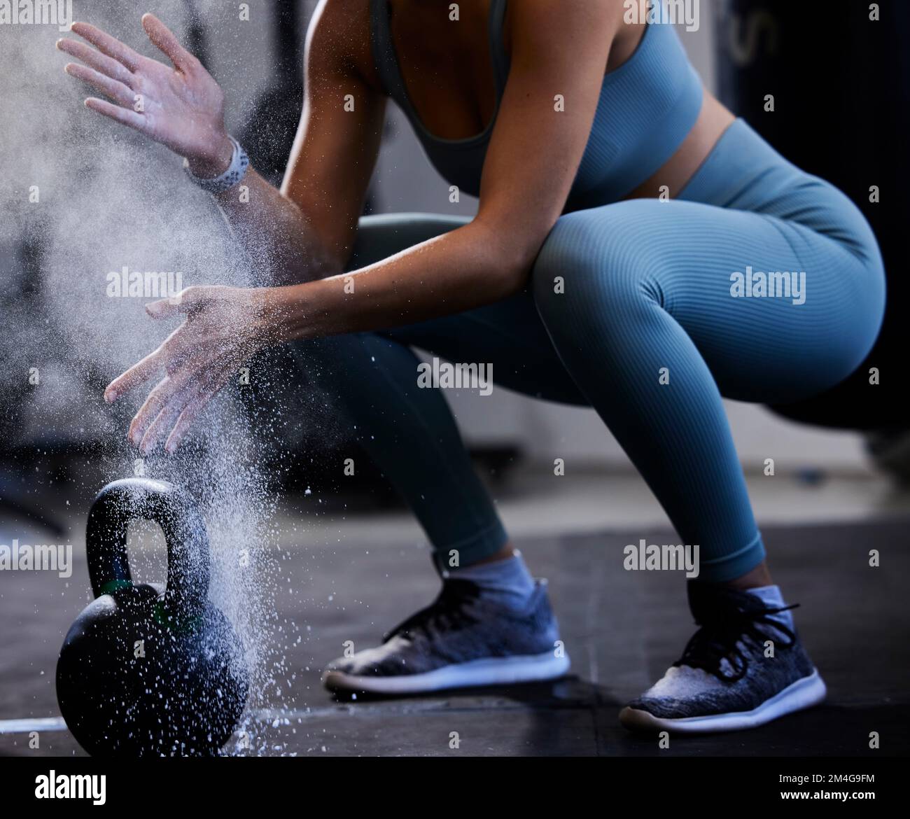 Woman, powder hands and kettlebell exercise, challenge and workout in