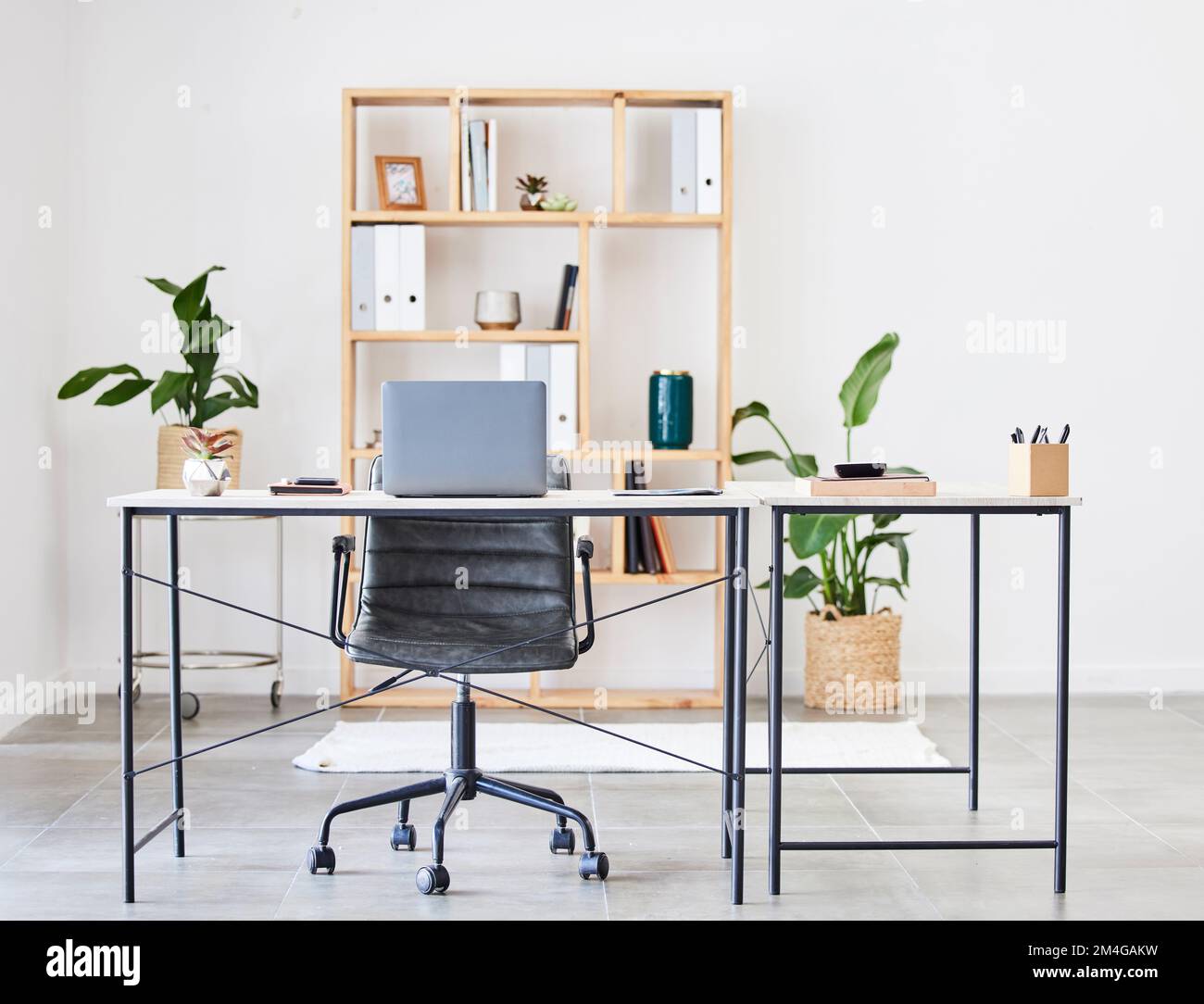 Empty office, table or desk in a home office interior or office desk with pens, plants or