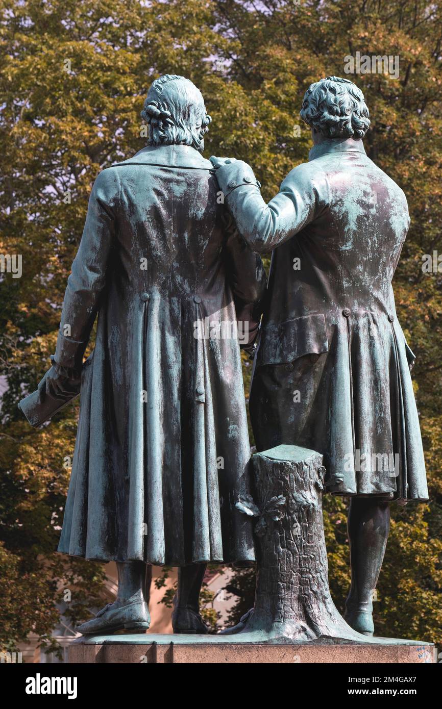 Goethe-Schiller Monument, bronze double statue in front of the Deutsches Nationaltheater, back view, Germany, Thueringen, Weimar Stock Photo