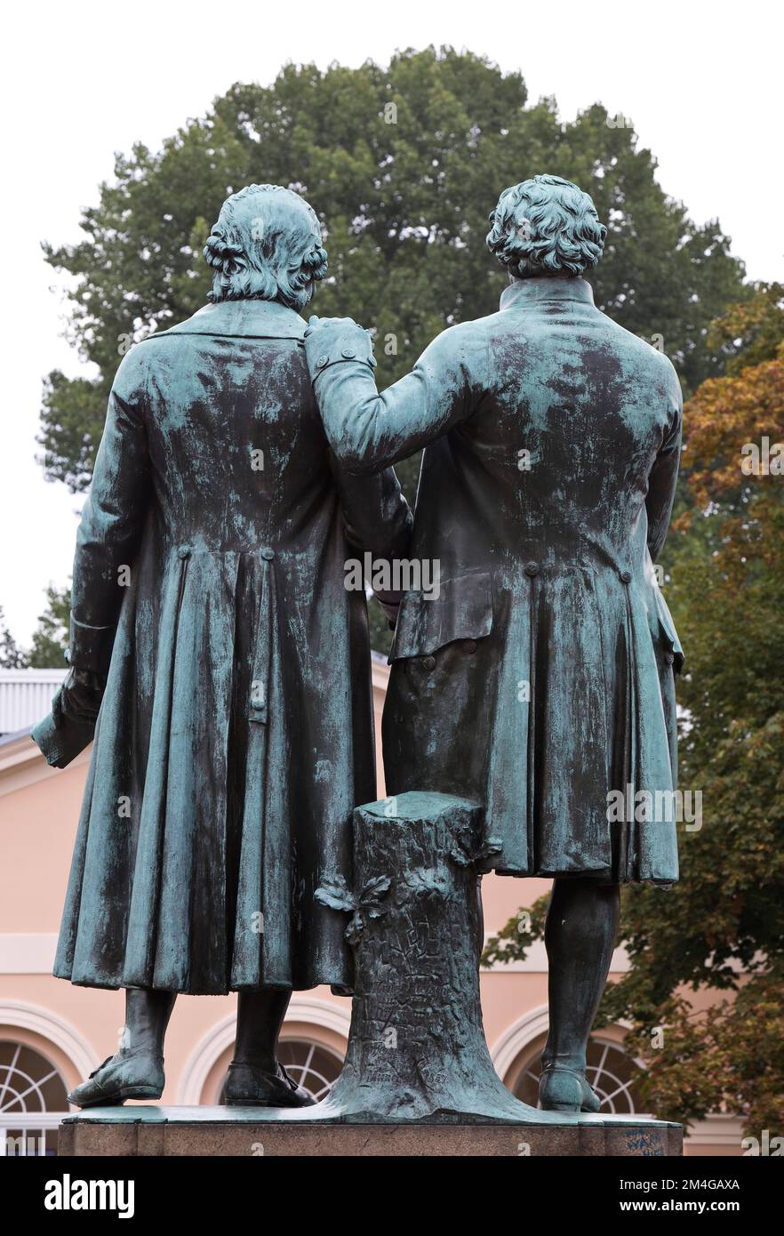 Goethe-Schiller Monument, bronze double statue in front of the Deutsches Nationaltheater, back view, Germany, Thueringen, Weimar Stock Photo