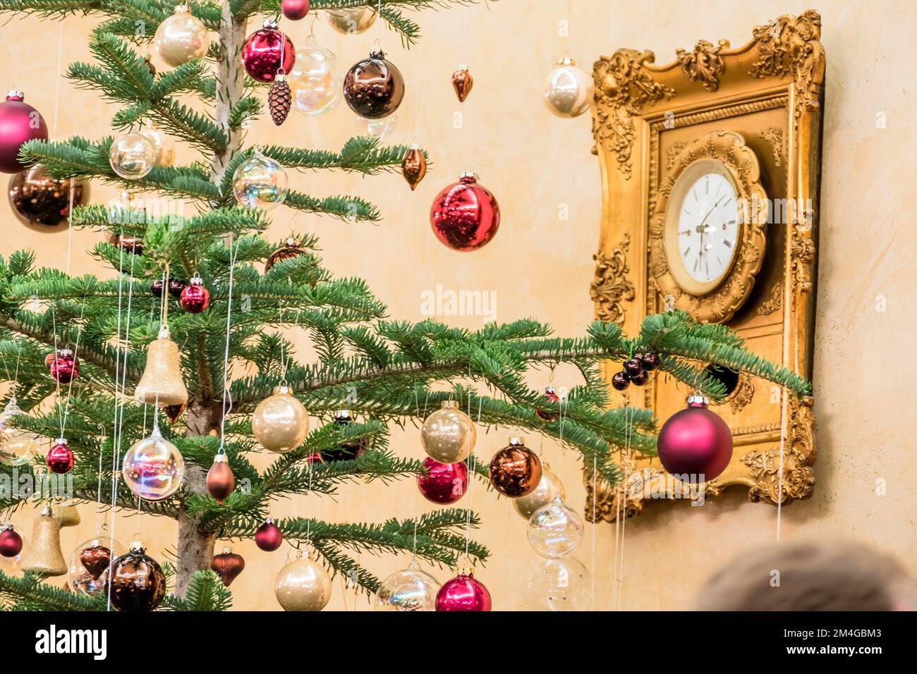 Christmas tree an wallclock Stock Photo Alamy