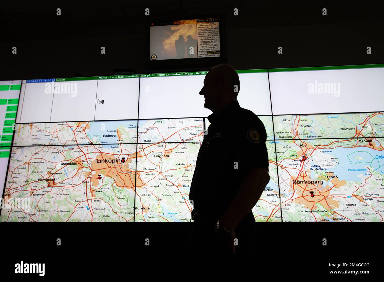 A fire station. Rescue commander in a communication room of the
