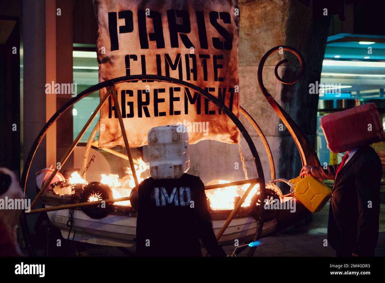 London, UK. 15th November, 2020. Members of Ocean Rebellion, perform an action at the London Headquarters of the International Maritime Organization (IMO) igniting a viking funeral pyre on the sidewalk outside the UN agency’s London headquarters to highlight the backtracking of the global shipping industry against the Paris Climate Agreement. Stock Photo