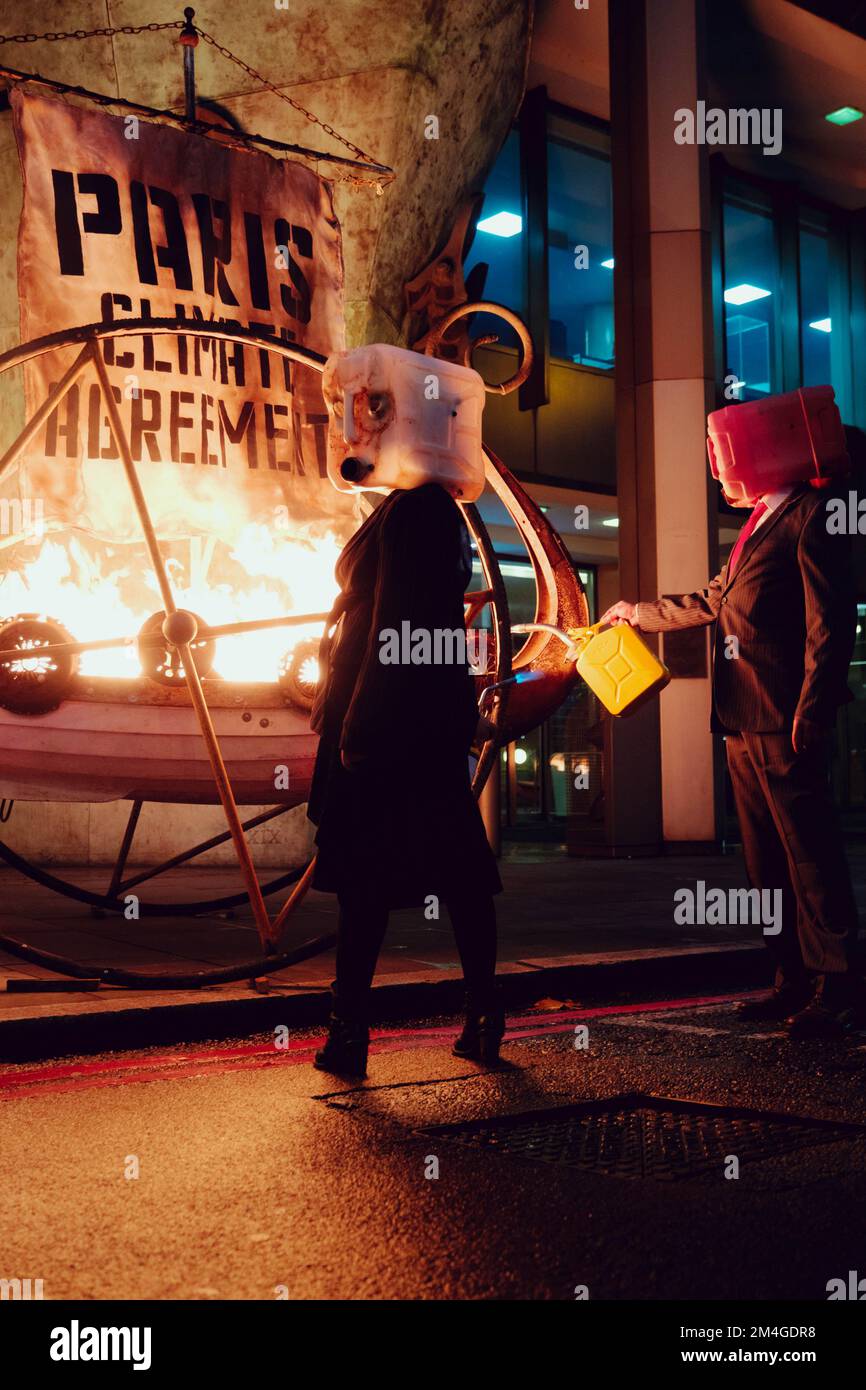 London, UK. 15th November, 2020. Members of Ocean Rebellion, perform an action at the London Headquarters of the International Maritime Organization (IMO) igniting a viking funeral pyre on the sidewalk outside the UN agency’s London headquarters to highlight the backtracking of the global shipping industry against the Paris Climate Agreement. Stock Photo